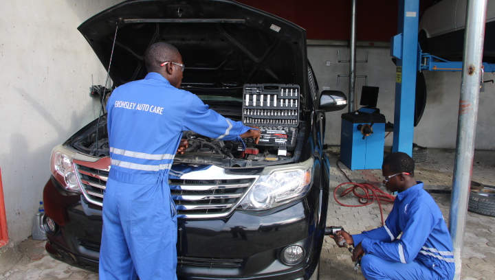 Technician working on vehicle
