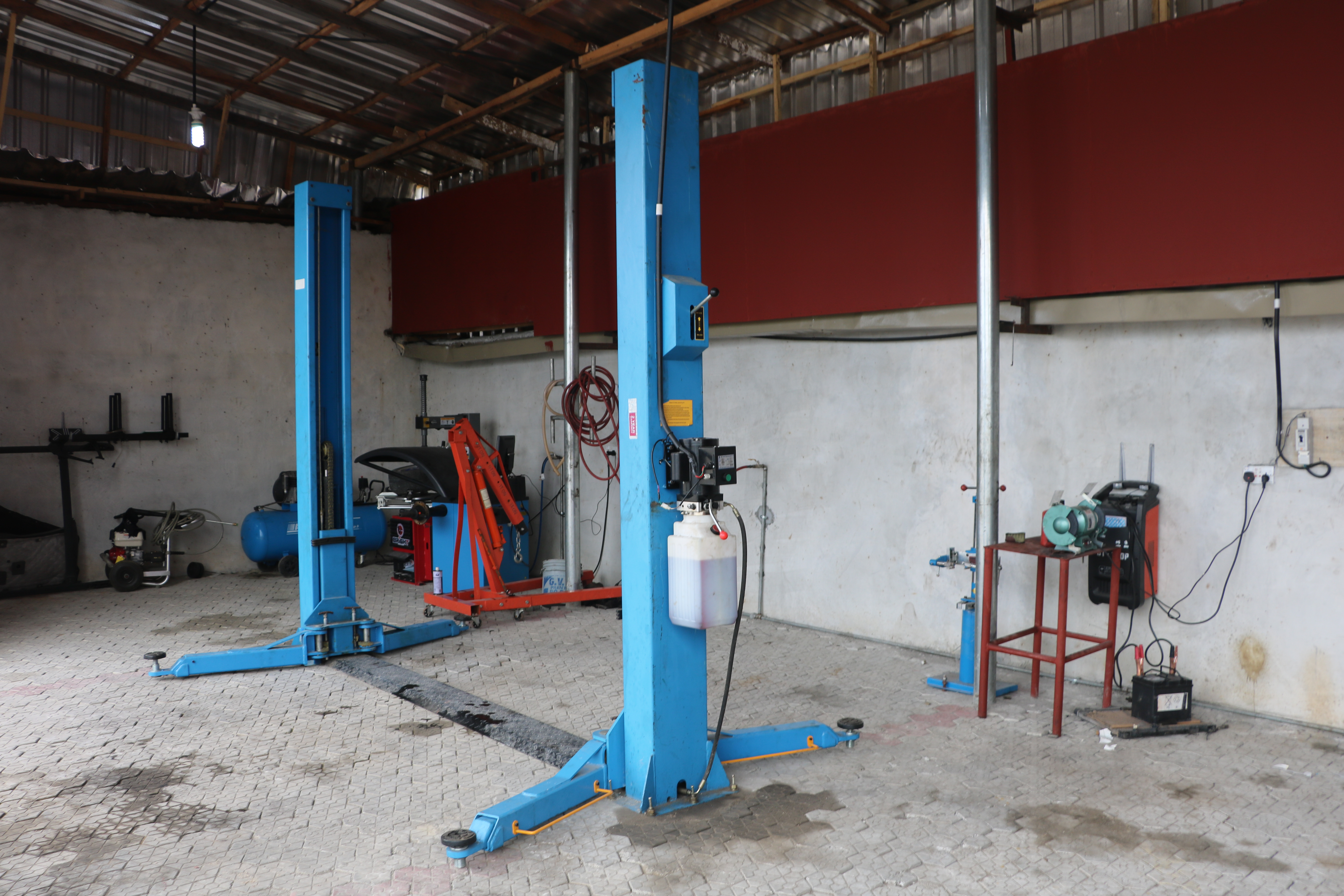 Vehicle on lift in workshop